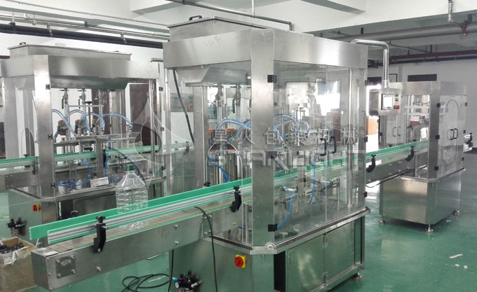 全自动压盖机再食用油灌装线中的应用